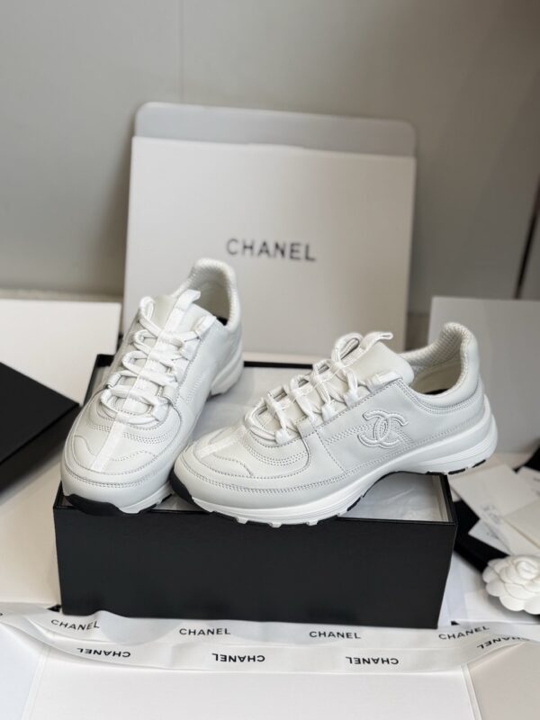 sy_no_7D98149B507AA08F936FFFEFB882303B_0 Chanel All-White Leather Low-Top Sneaker with Embossed CC Logo