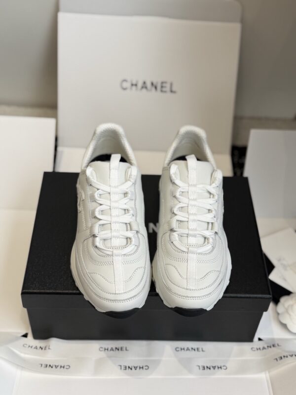 sy_no_7D98149B507AA08F936FFFEFB882303B_1 Chanel All-White Leather Low-Top Sneaker with Embossed CC Logo