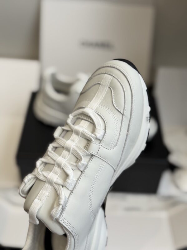 sy_no_7D98149B507AA08F936FFFEFB882303B_2 Chanel All-White Leather Low-Top Sneaker with Embossed CC Logo