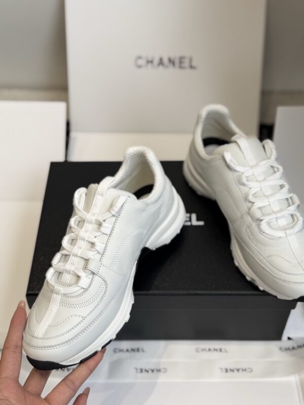 sy_no_7D98149B507AA08F936FFFEFB882303B_3 Chanel All-White Leather Low-Top Sneaker with Embossed CC Logo