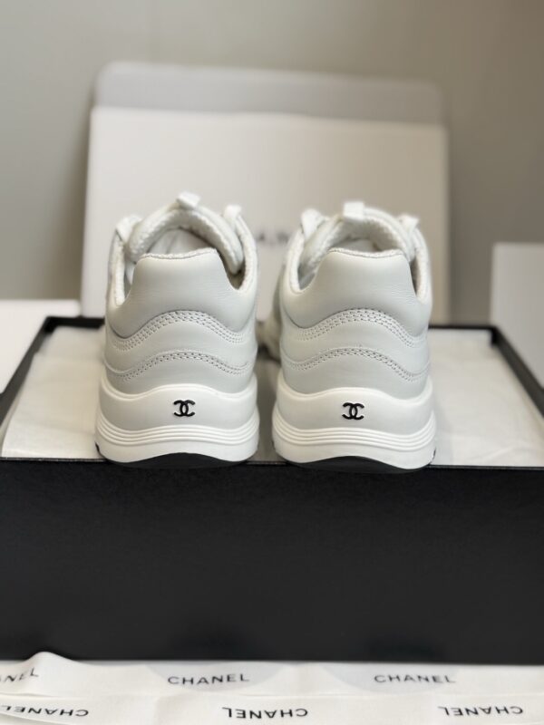 sy_no_7D98149B507AA08F936FFFEFB882303B_5 Chanel All-White Leather Low-Top Sneaker with Embossed CC Logo