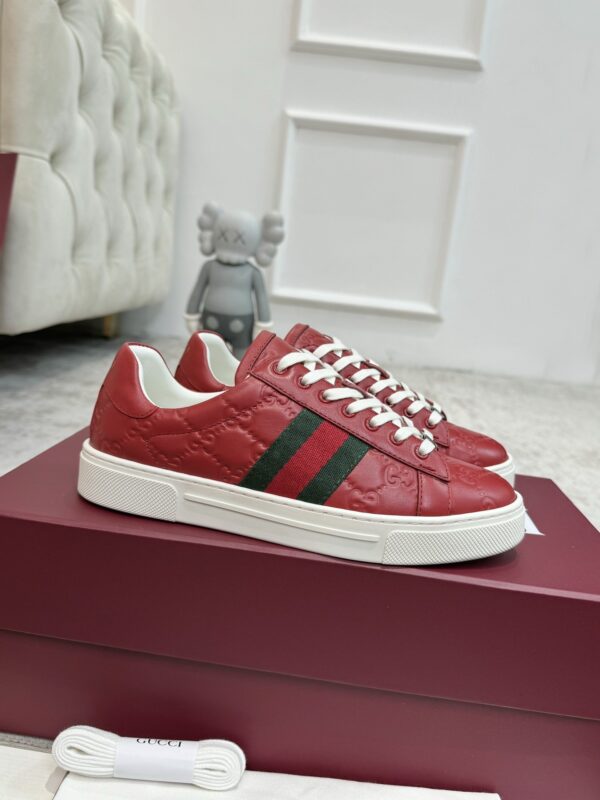 sy_no_7F1D635BC94D8FBAB54A549D0EA07F87_0 Gucci GG Embossed Leather Screener Sneaker in Red
