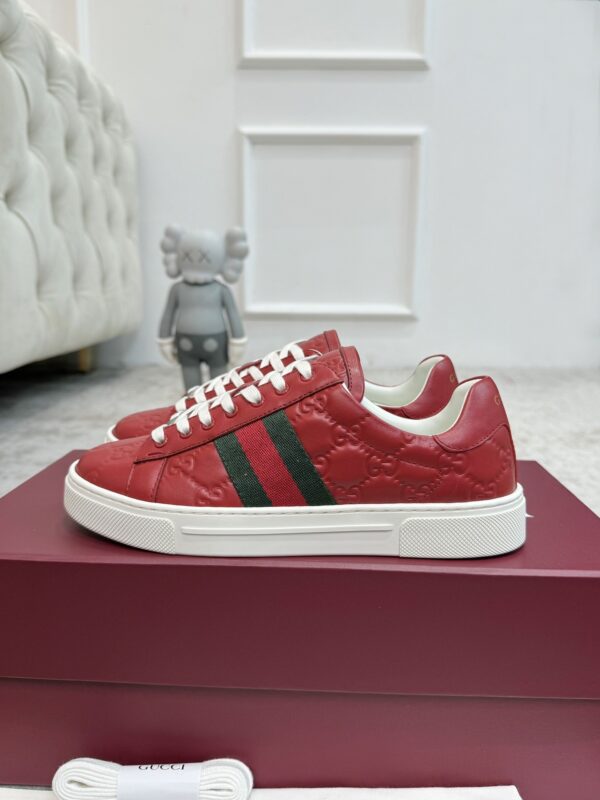 sy_no_7F1D635BC94D8FBAB54A549D0EA07F87_2 Gucci GG Embossed Leather Screener Sneaker in Red