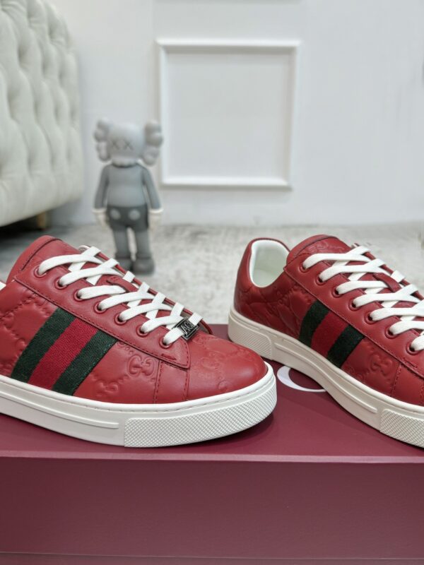 sy_no_7F1D635BC94D8FBAB54A549D0EA07F87_7 Gucci GG Embossed Leather Screener Sneaker in Red