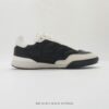 Chanel Black-White Mixed-Material Low-Top Sneaker with Quilted Leather and CC Logo