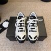 sy_no_87031BBE529B659C1F04D1A4A1F9094B_0 Chanel White and Black Colorblock Low-Top Sneaker with CC Logo