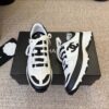 sy_no_87031BBE529B659C1F04D1A4A1F9094B_1 Chanel White and Black Colorblock Low-Top Sneaker with CC Logo