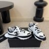 sy_no_87031BBE529B659C1F04D1A4A1F9094B_4 Chanel White and Black Colorblock Low-Top Sneaker with CC Logo