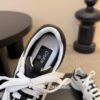 sy_no_87031BBE529B659C1F04D1A4A1F9094B_6 Chanel White and Black Colorblock Low-Top Sneaker with CC Logo