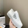 sy_no_878C2928CDBA44C004805BC79FF023A1_0 Prada White Canvas Black-Trim Triangle Tread Platform Sneaker