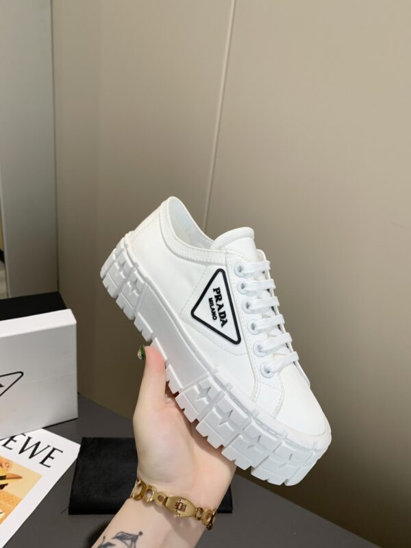 sy_no_878C2928CDBA44C004805BC79FF023A1_0 Prada White Canvas Black-Trim Triangle Tread Platform Sneaker
