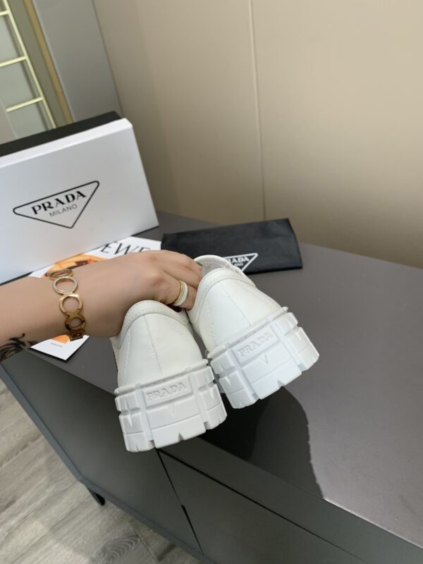sy_no_878C2928CDBA44C004805BC79FF023A1_7 Prada White Canvas Black-Trim Triangle Tread Platform Sneaker