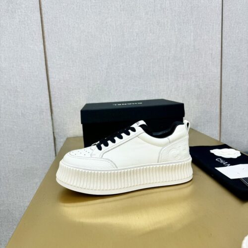 sy_no_89259C145494347802A26325E75A0481_0 Chanel Off-White Leather Platform Low-Top Sneaker with Black Laces and Ribbed Sole