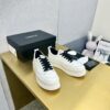 sy_no_89259C145494347802A26325E75A0481_1 Chanel Off-White Leather Platform Low-Top Sneaker with Black Laces and Ribbed Sole