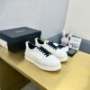 sy_no_89259C145494347802A26325E75A0481_2 Chanel Off-White Leather Platform Low-Top Sneaker with Black Laces and Ribbed Sole