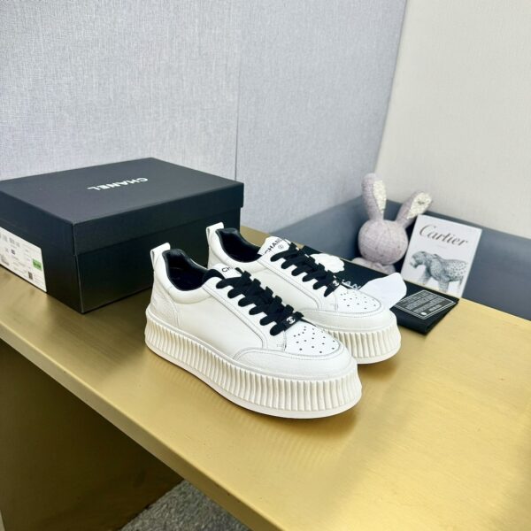 sy_no_89259C145494347802A26325E75A0481_2 Chanel Off-White Leather Platform Low-Top Sneaker with Black Laces and Ribbed Sole