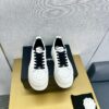 sy_no_89259C145494347802A26325E75A0481_3 Chanel Off-White Leather Platform Low-Top Sneaker with Black Laces and Ribbed Sole