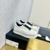 sy_no_89259C145494347802A26325E75A0481_4 Chanel Off-White Leather Platform Low-Top Sneaker with Black Laces and Ribbed Sole