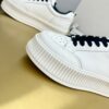 sy_no_89259C145494347802A26325E75A0481_6 Chanel Off-White Leather Platform Low-Top Sneaker with Black Laces and Ribbed Sole
