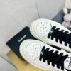 sy_no_89259C145494347802A26325E75A0481_7 Chanel Off-White Leather Platform Low-Top Sneaker with Black Laces and Ribbed Sole