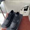 Prada All-Black Leather Metal Triangle Platform Sneaker