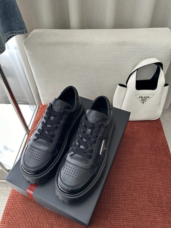 Prada All-Black Leather Metal Triangle Platform Sneaker