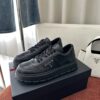 Prada All-Black Leather Metal Triangle Platform Sneaker