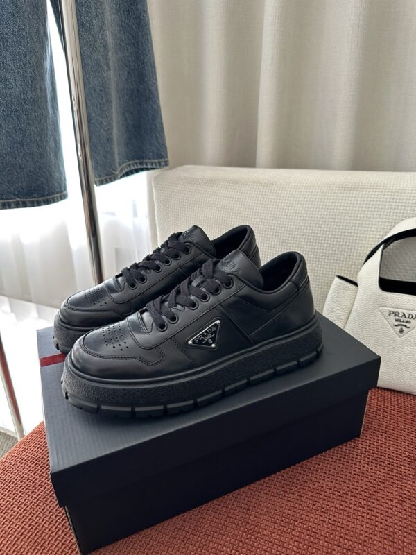 Prada All-Black Leather Metal Triangle Platform Sneaker