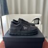 Prada All-Black Leather Metal Triangle Platform Sneaker