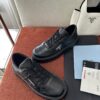 Prada All-Black Leather Metal Triangle Platform Sneaker