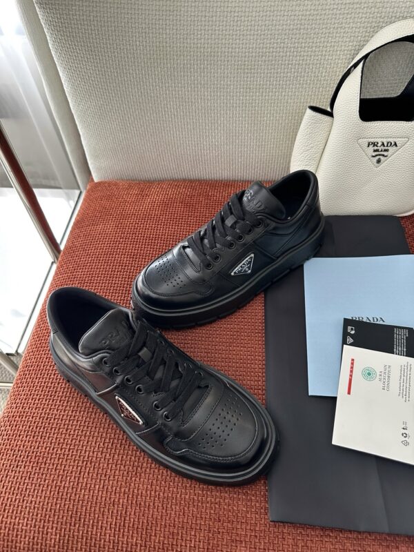 Prada All-Black Leather Metal Triangle Platform Sneaker