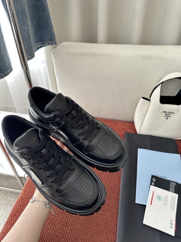 Prada All-Black Leather Metal Triangle Platform Sneaker