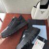 Prada All-Black Leather Metal Triangle Platform Sneaker