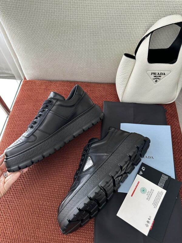 Prada All-Black Leather Metal Triangle Platform Sneaker