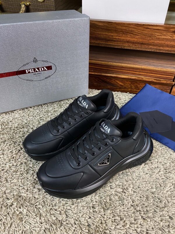 sy_no_8CA9FCC3D217E8A4254B61C3172F9DF9_1 Prada Black Leather Triangle Logo Thick-Sole Low-Top Sneaker