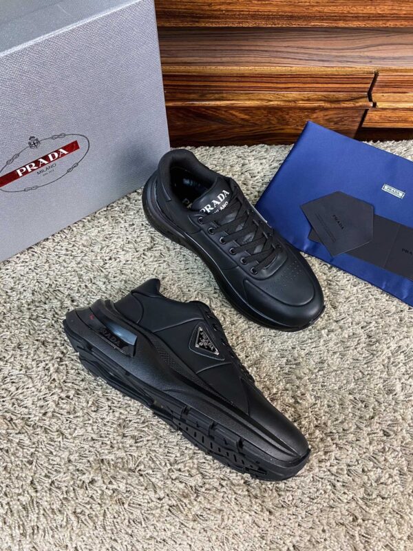 sy_no_8CA9FCC3D217E8A4254B61C3172F9DF9_2 Prada Black Leather Triangle Logo Thick-Sole Low-Top Sneaker