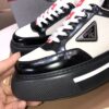 Prada Black-White Patent Mesh Red-Tongue Platform Sneaker