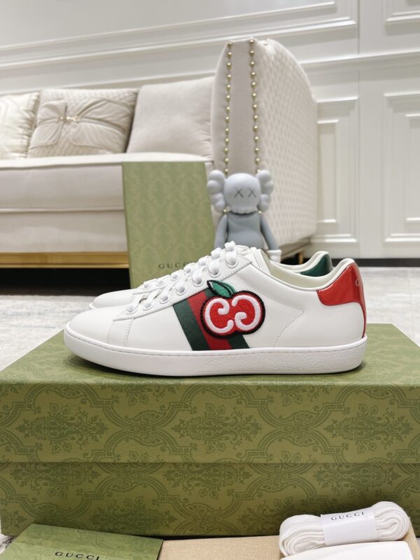 sy_no_A919EE0AC10E68ED0E33DB7D6F6A55BB_2 Gucci White Leather Low-Top Sneaker with Apple Interlocking G and Web Stripe