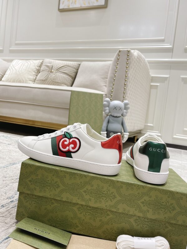 sy_no_A919EE0AC10E68ED0E33DB7D6F6A55BB_3 Gucci White Leather Low-Top Sneaker with Apple Interlocking G and Web Stripe
