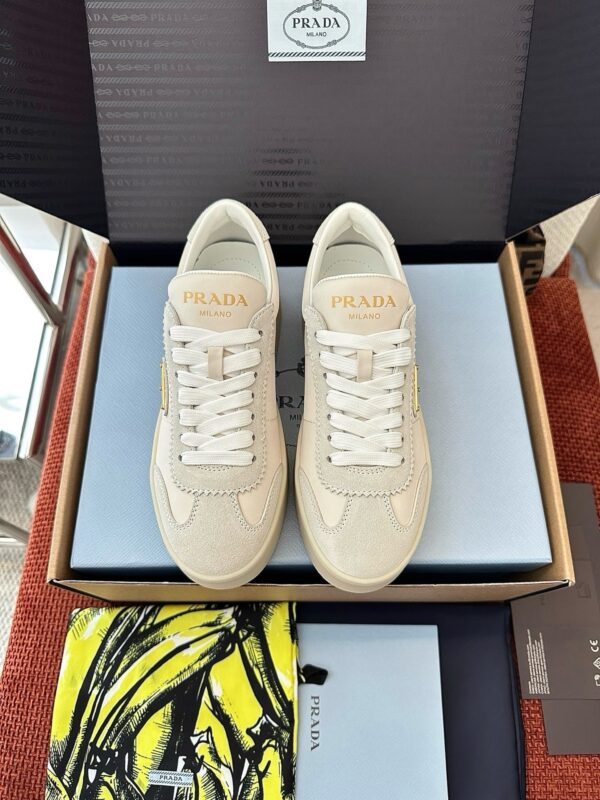 sy_no_B070B9A49641834C79A6C9DE2055A510_0 Prada Off-White Suede Gold Triangle Platform Sneaker