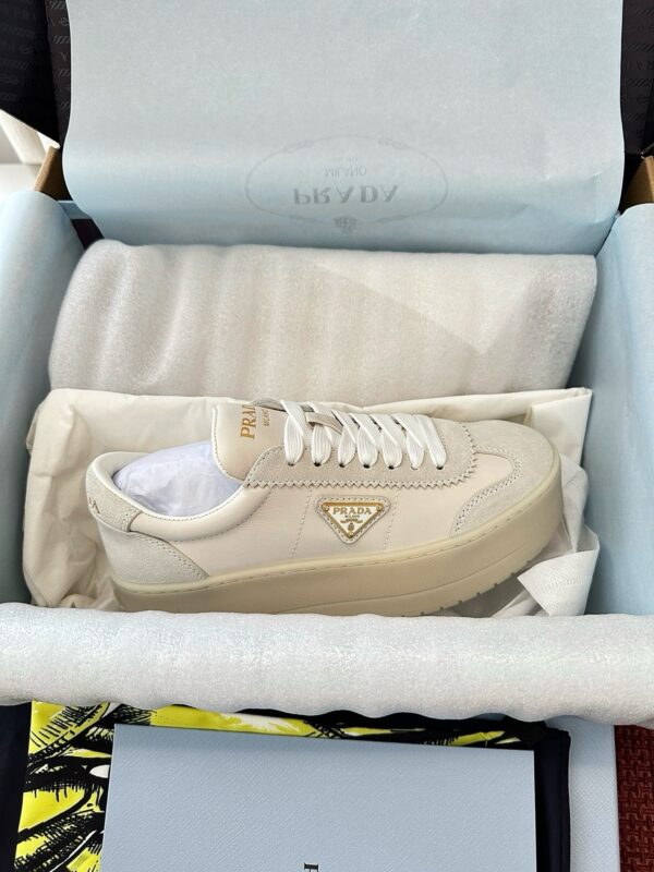 sy_no_B070B9A49641834C79A6C9DE2055A510_1 Prada Off-White Suede Gold Triangle Platform Sneaker