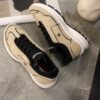 Chanel Beige and Black Mixed Material Low-Top Sneaker with Contrast Piping and CC Logo