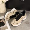 Chanel Beige and Black Mixed Material Low-Top Sneaker with Contrast Piping and CC Logo