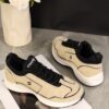 Chanel Beige and Black Mixed Material Low-Top Sneaker with Contrast Piping and CC Logo
