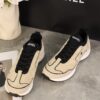 Chanel Beige and Black Mixed Material Low-Top Sneaker with Contrast Piping and CC Logo