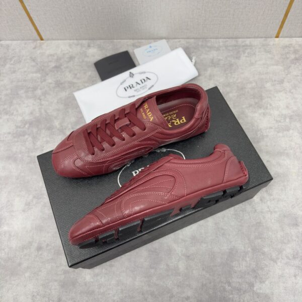sy_no_B7B9F0D7CA16817245D4B4CCDB59A001_1 Prada Burgundy Leather Gold Logo Trainer