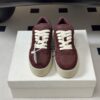 Prada Burgundy Suede Gold Triangle Platform Sneaker