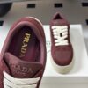 Prada Burgundy Suede Gold Triangle Platform Sneaker