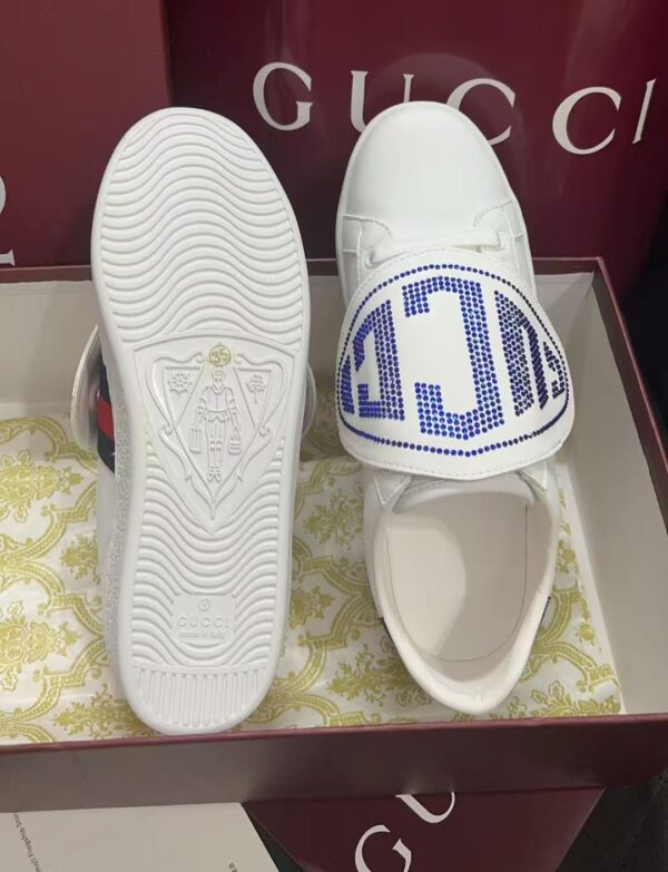 sy_no_BC8106A8DE57409D19499546F5F3EFE0_1 Gucci White Leather Low-Top Sneaker with Large Crystal Logo Flap
