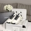 sy_no_BCB44C72A0CBB640D9AFA7D630A9F012_0 Chanel White and Black Mixed Material Low-Top Sneaker with Gold Hardware CC Logo